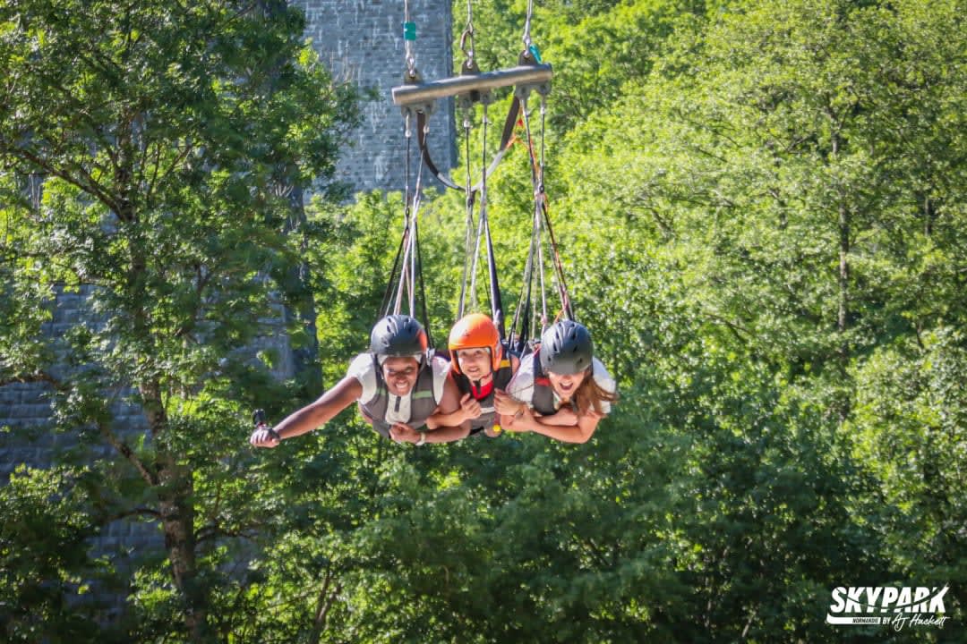 Three girls in the Giant Swing at SkyPark Normandie