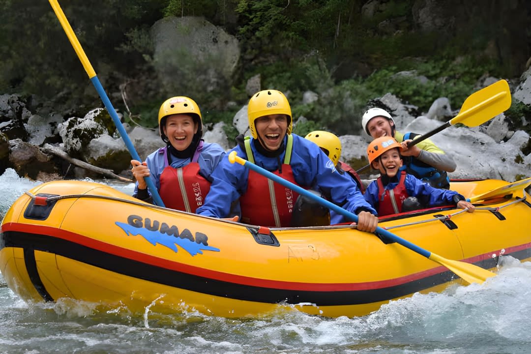 A family doing Rafting excursion on the Soča River in Bovec