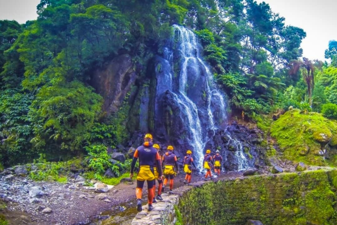 A group doing a canyoning excursion at Ribeira dos Caldeiroes in São Miguel Island