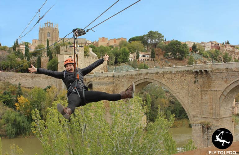 Woman ziplining above the village of Toledo and the San Martin river