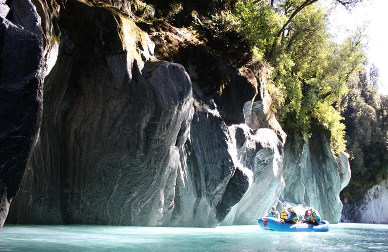 Whitewater river rafting in Whataroa river near Franz Josef Galcier