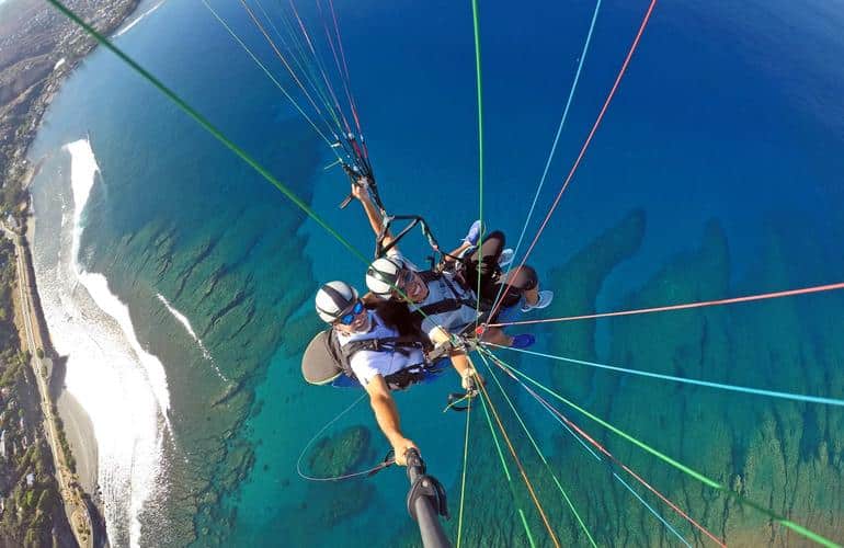 paragliding flight over the bay of saint leu