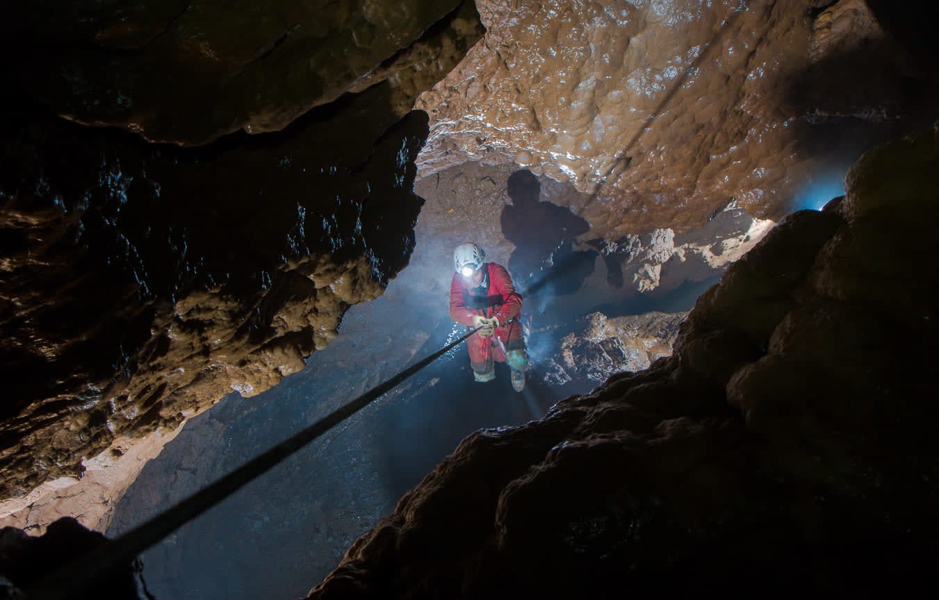 abseiling in a cave