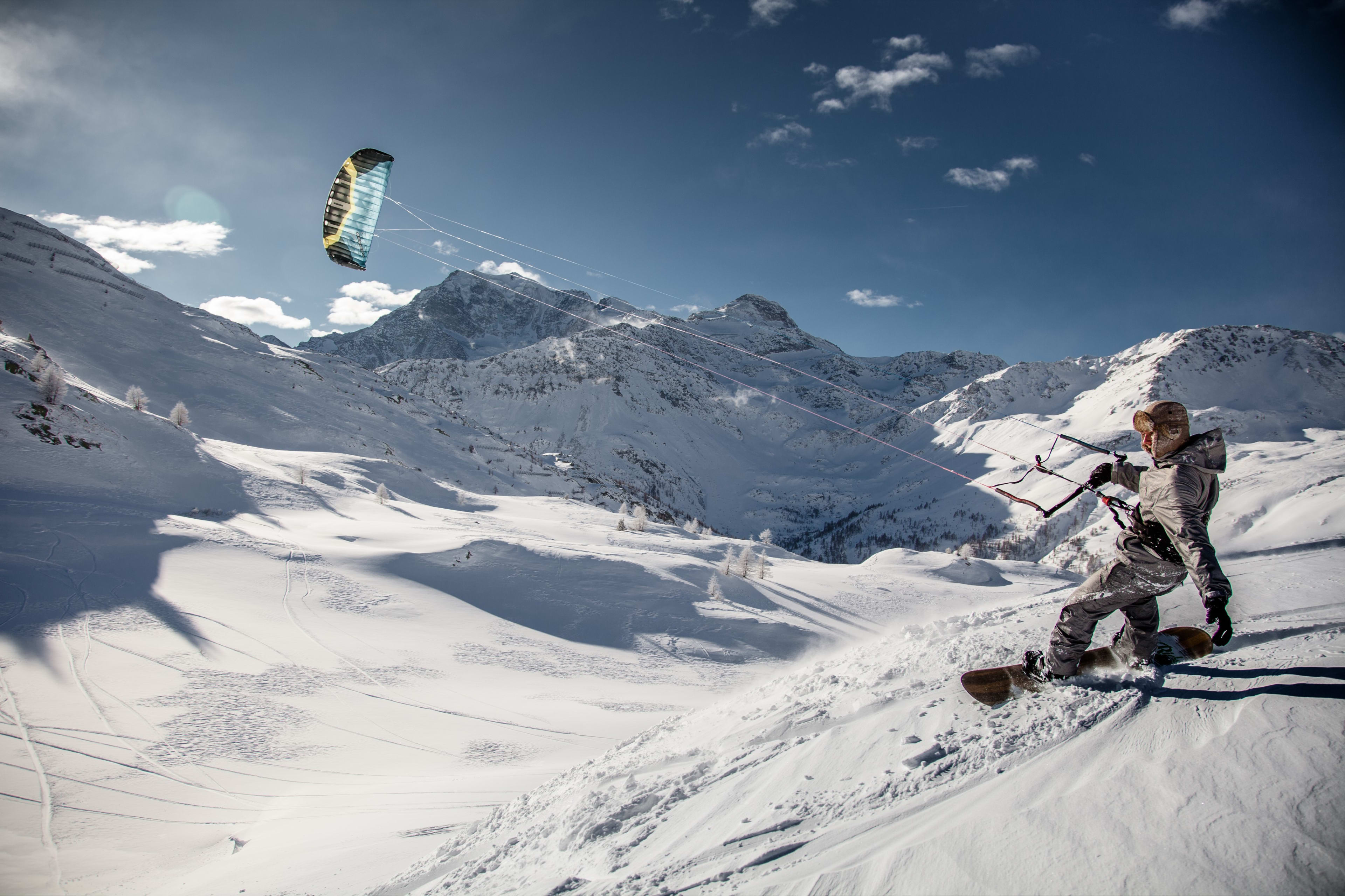 Snowkiter in the snowy mountains of Brig, Switzerland