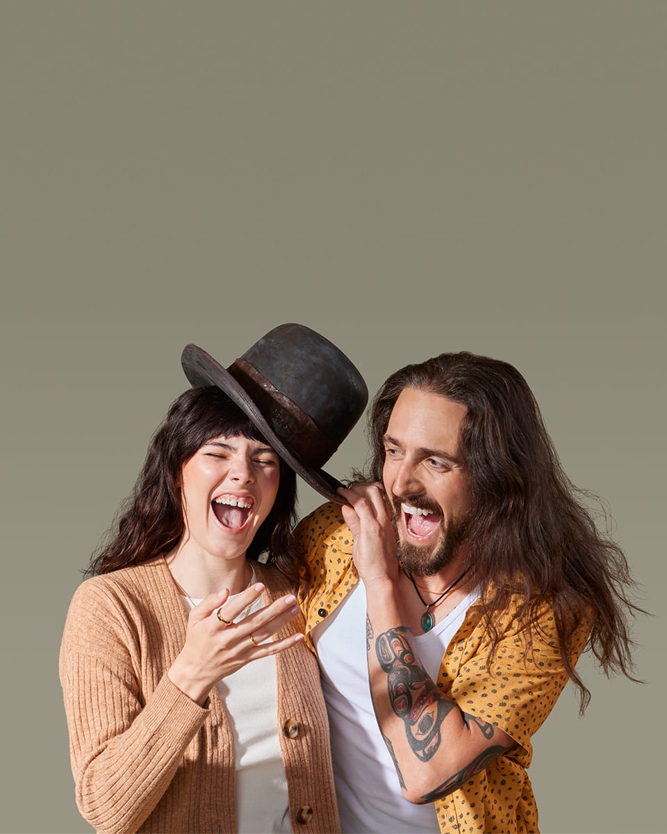 Model couple laughing and holding each other