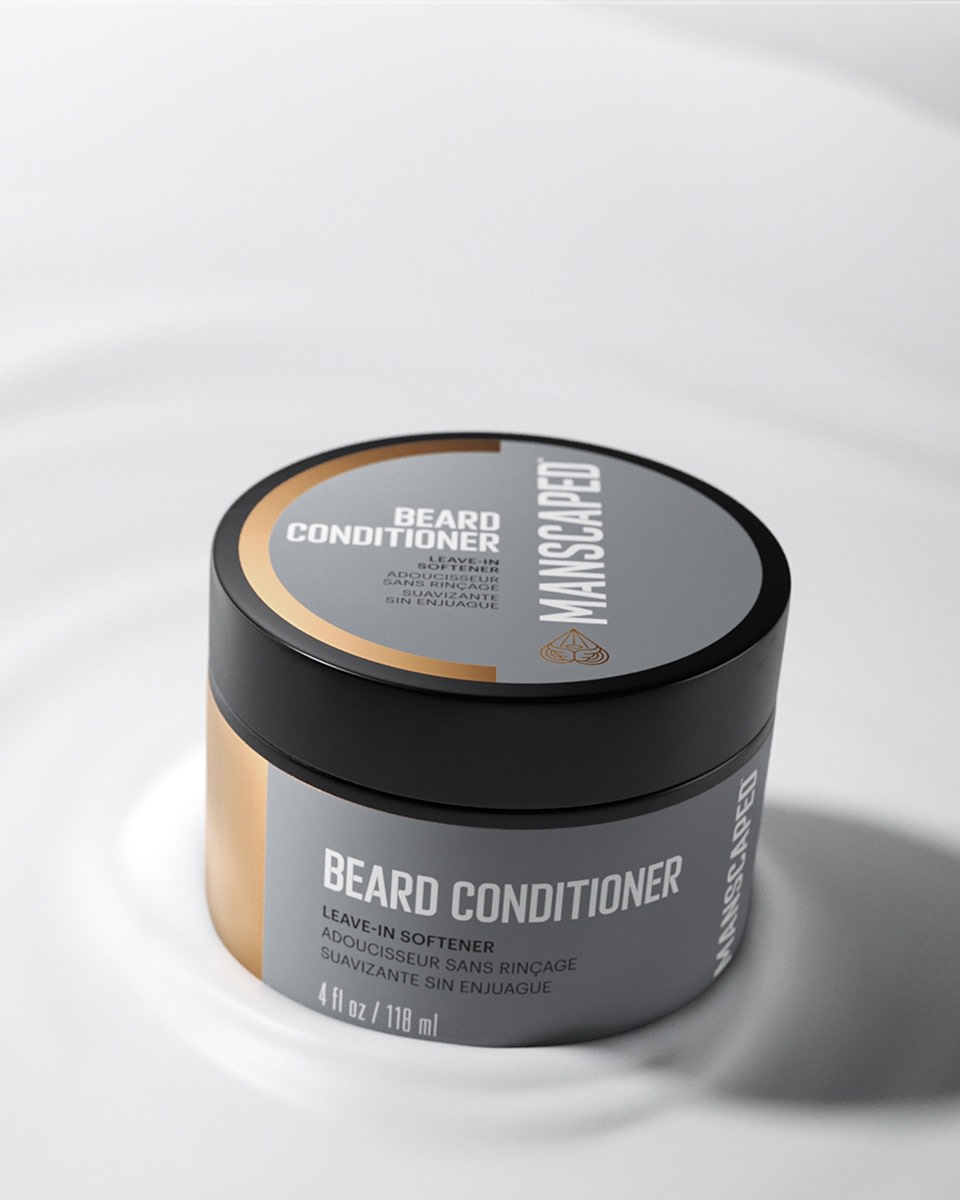 Close up of the Beard Conditioner jar sitting in a pool of coconut oil