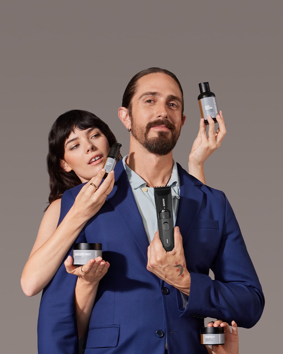 Male and female model couple holding all new MANSCAPED® beard formulations 