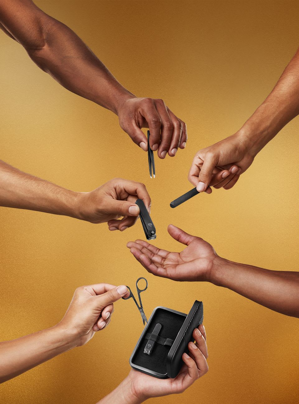 Male model holding all 5 pieces of The Shears 3.0 and it's carrying case on their feet and hands for display