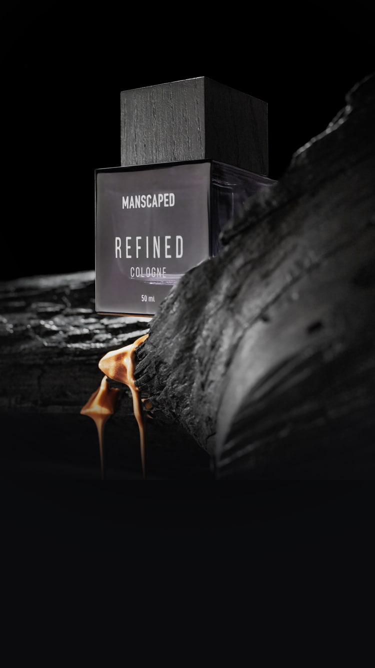 Close-up of the Refined® Cologne and the light woods fragrance