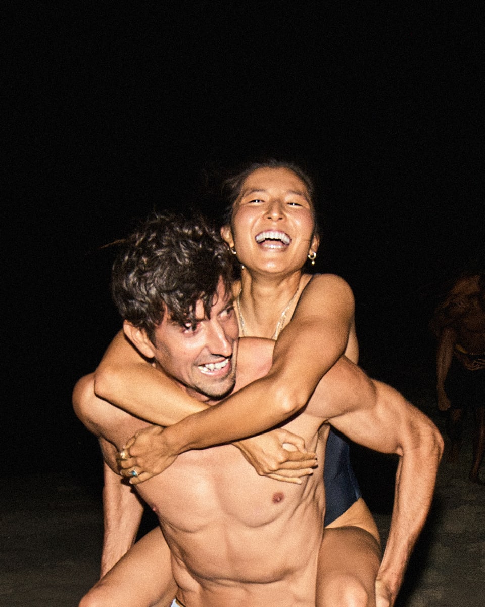 Man giving his girlfriend a piggyback ride