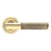 From The Anvil Aged Brass Knurled Door Handles on Round Art Deco Rose - Brompton Range