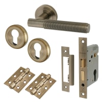 Altro Antique Brass Reeded Euro Lock Door Handles on Rose Pack - Lily Range