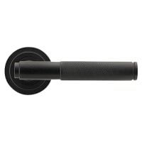 From The Anvil Matt Black Knurled Door Handles on Round Art Deco Rose - Brompton Range