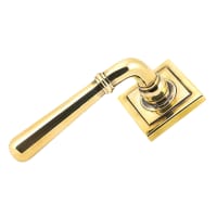 From The Anvil Aged Brass Door Handles on Square Rose - Newbury Range