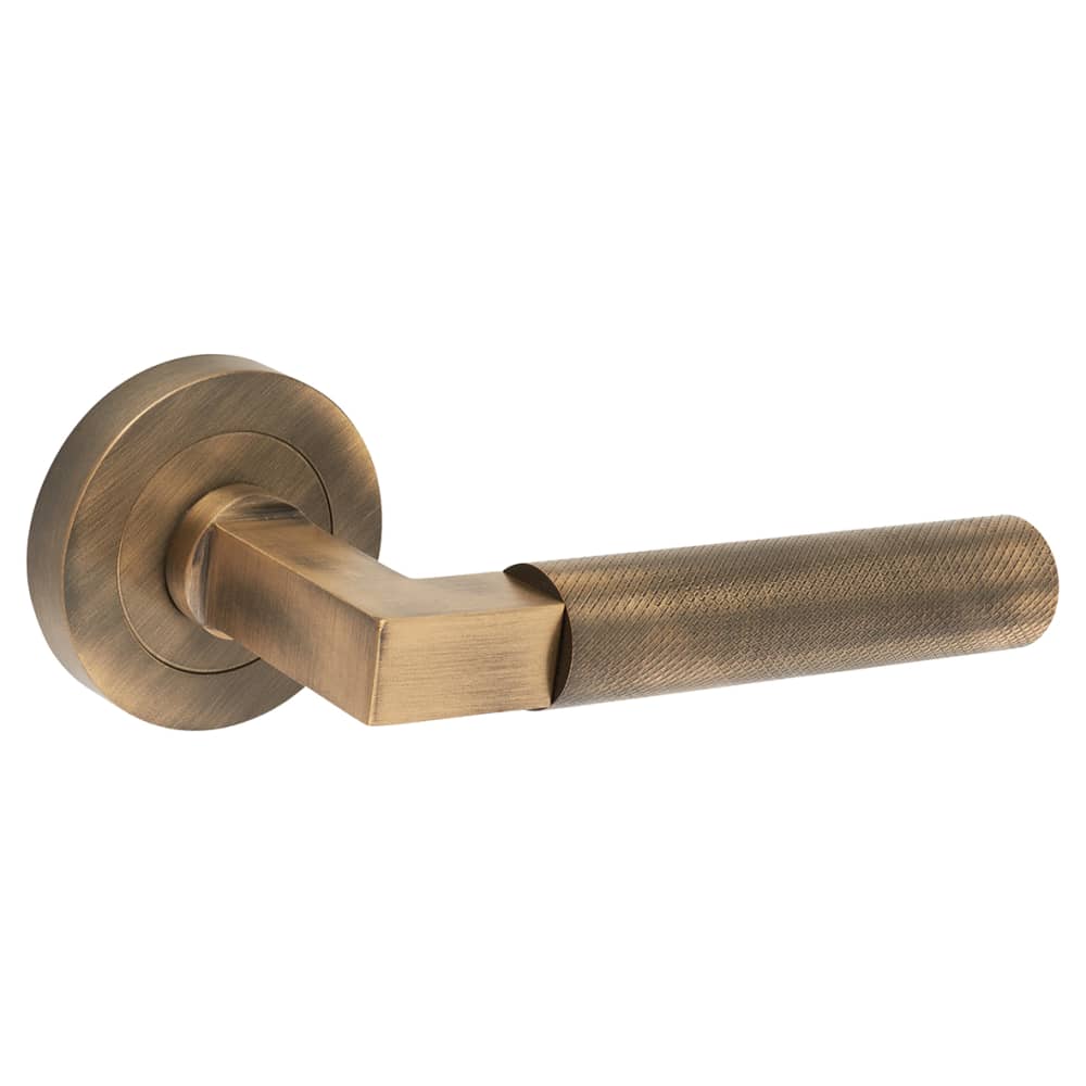 Hampstead Solid Brass Knurled Lever Door Handle on Rose Antique Brass IronmongeryDirect