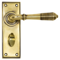 From The Anvil Aged Brass Reeded Bathroom Door Handles - 152 x 50mm