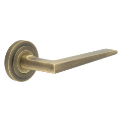Burlington by Frelan Antique Brass Fire Rated Door Handles on Round Stepped Rose - Mayfair Range