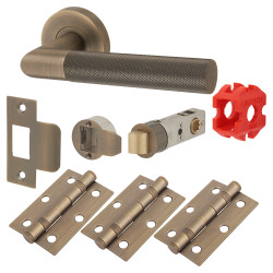 Jigtech Matt Antique Brass Knurled Latch Door Handles on Rose Pack - Passage - Tactil Range