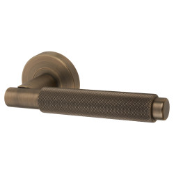Jigtech Matt Antique Brass Knurled Door Handles on Round Rose - Textura Range