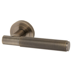 Altro Antique Brass Reeded Door Handles on Round Rose - Lily Range