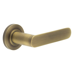Burlington by Frelan Antique Brass Fire Rated Door Handles on Round Reeded Rose - Kensington Range