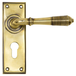 From The Anvil Aged Brass Reeded Euro Lock Door Handles - 152 x 50mm