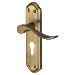 Heritage Brass by M Marcus Antique Brass Scroll Euro Lock Door Handles - Sandown Range - 180 x 48mm