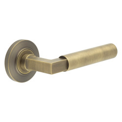 Burlington by Frelan Antique Brass Fire Rated Door Handles on Round Chamfered Rose - Westminster Range