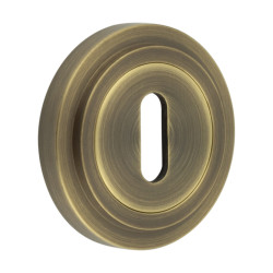 Burlington BUR60 by Frelan Escutcheon on Stepped Rose - 53mm Diameter - Keyhole - Antique Brass