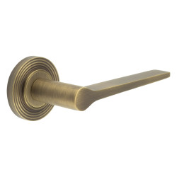 Burlington by Frelan Antique Brass Fire Rated Door Handles on Round Reeded Rose - Knightsbridge Range