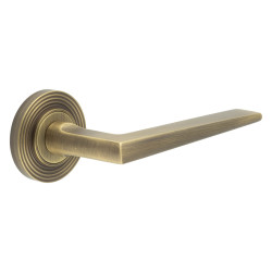 Burlington by Frelan Antique Brass Fire Rated Door Handles on Round Reeded Rose - Mayfair Range