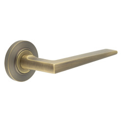 Burlington by Frelan Antique Brass Fire Rated Door Handles on Round Chamfered Rose - Mayfair Range