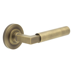 Burlington by Frelan Antique Brass Fire Rated Door Handles on Round Reeded Rose - Westminster Range