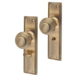 Hampstead Antique Brass Reeded Bathroom Mortice Door Knob on Backplate - 205 x 52mm - Miller Range