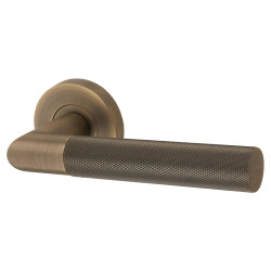 Jigtech Matt Antique Brass Knurled Door Handles on Round Rose - Tactil Range
