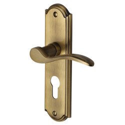 Heritage Brass by M Marcus Antique Brass Scroll Euro Lock Door Handles - Howard Range - 171 x 48mm