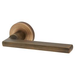 Carlisle Brass Antique Brass Door Handles on Round Rose - Trentino Range