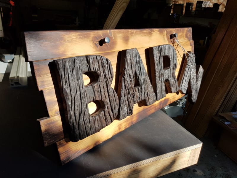 Handmade wooden sign by Daniel Strekier