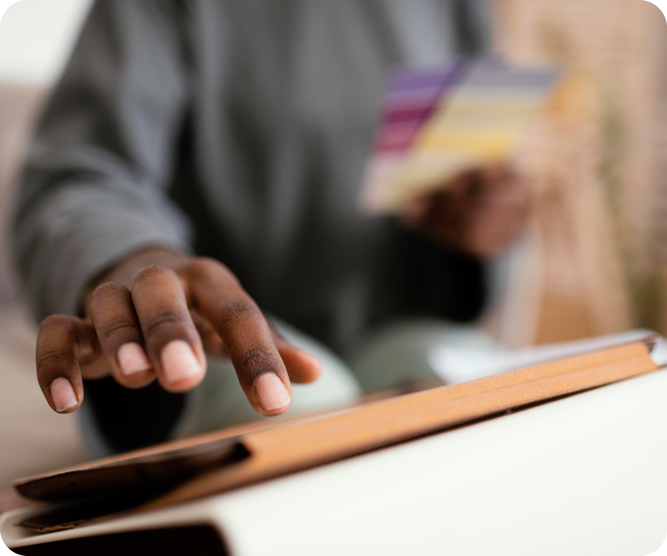 Black lady holding a point of sale, receiving payment