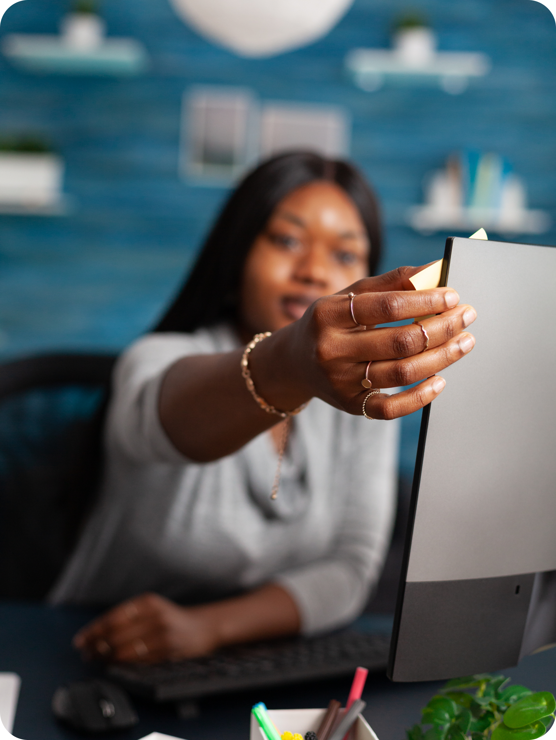 Black lady looking touching monitor screen