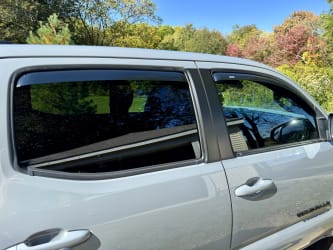 The exterior of my Tacoma, focusing on the passenger side windows, which are closed and have AVS in-channel vent shades installed.
