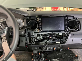 Inside the Tacoma, I’ve pulled off more of the plastic trim around and below the stereo in order to give myself access to the wires that eventually need to find their way up to the back of it.