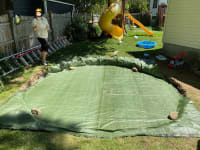 A twelve by sixteen foot tarp, in the hole, looking a little too small on two sides