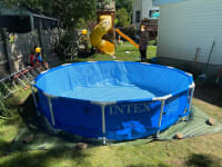 The pool, now placed in the hole that we dug for it