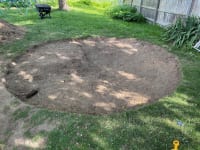 An in-progress photo of the most laborious part: the removal of a lot of dirt as we work toward leveling and flattening the ground