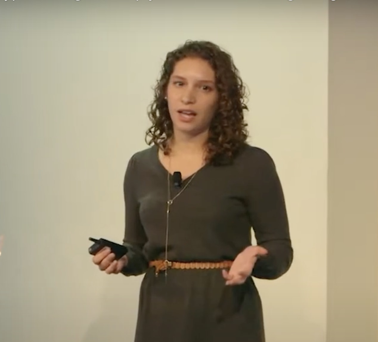 Marisa on stage speaking at Generate Conf.