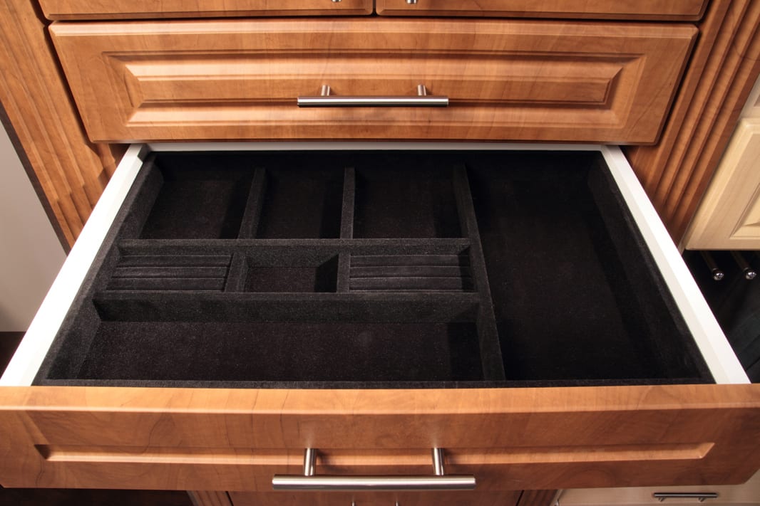 Custom velvet-lined jewelry drawer insert in a Markae closet