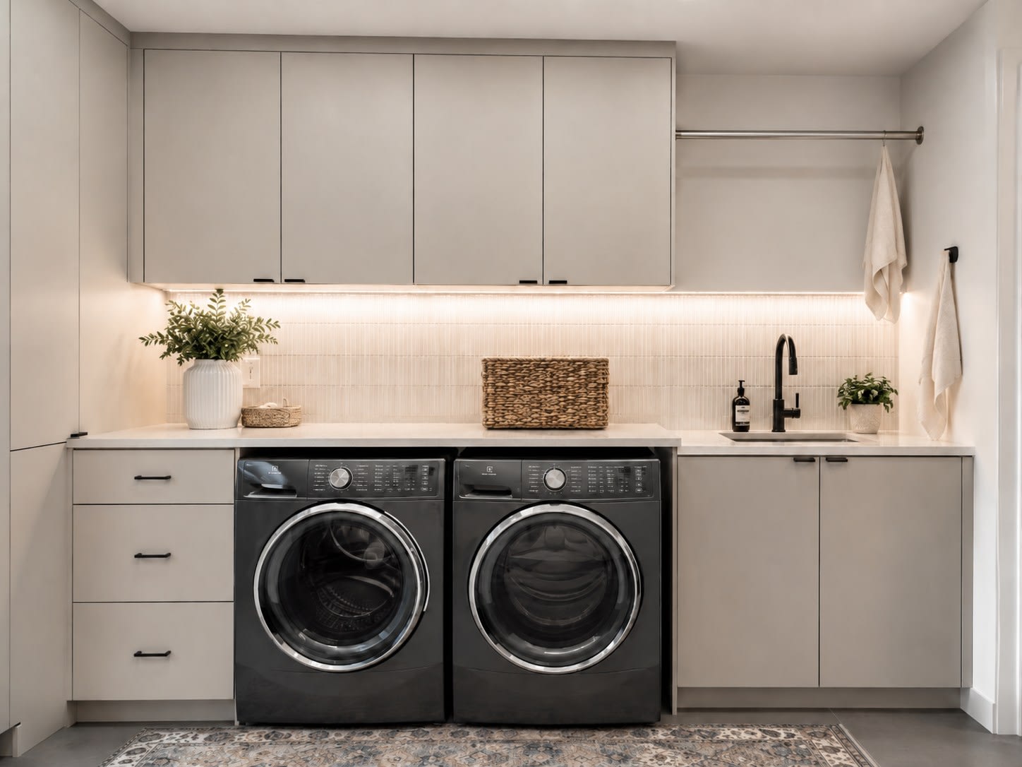 Custom laundry room with cabinetry