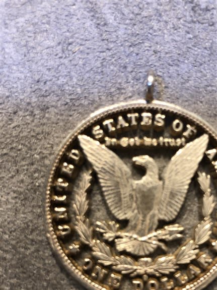 This is a real Morgan Silver Dollar that I cut out with a jewelers saw.