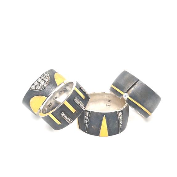 An array of pendants made using 925 oxidized sterling silver, and precious and semi-precious stones An array of pendants made using 925 oxidized sterling silver, and precious and semi-precious stones